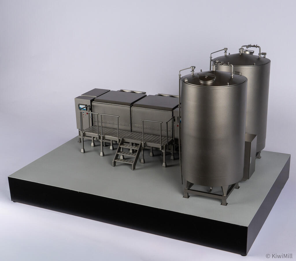 Water tanks seen from the front right, top manway and piping on the near tank, cook tank platform behind